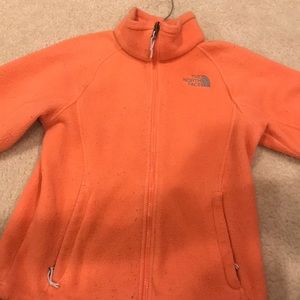 The North Face: Orange zip up jacket: